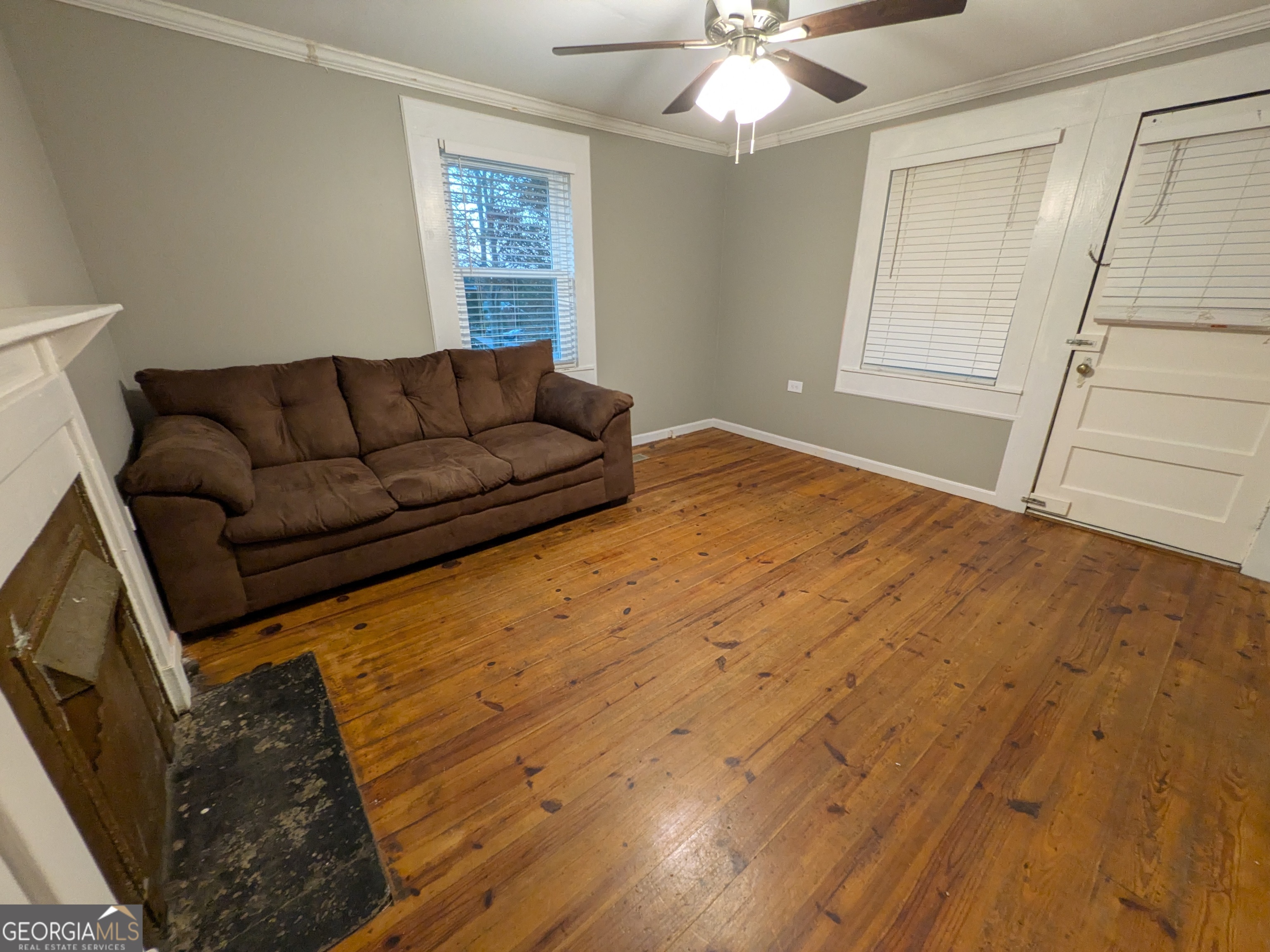 173 Baugh Street Commerce, GA 30529 - Photo 15 of 24 a living room with a couch and wooden floor