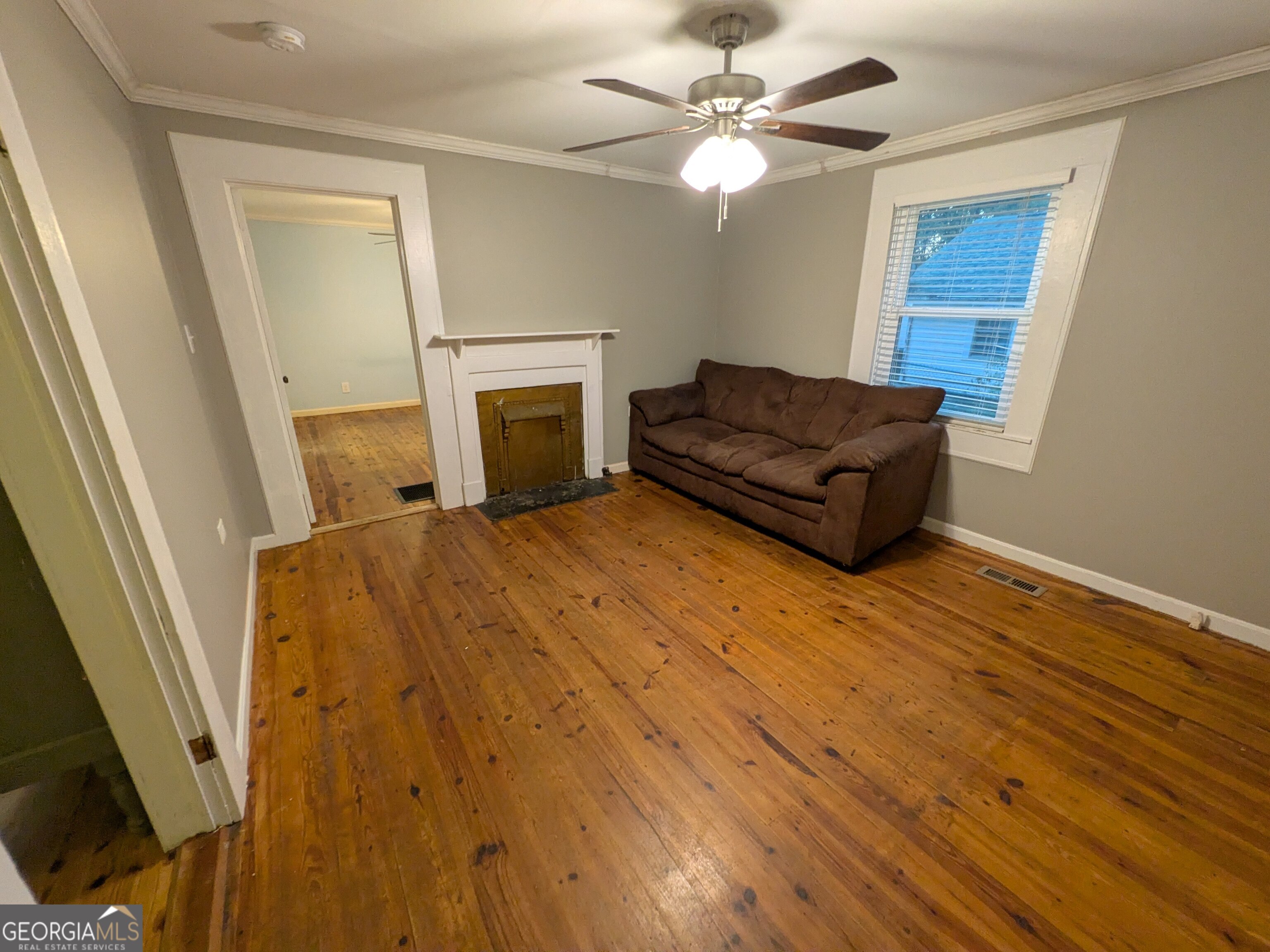 173 Baugh Street Commerce, GA 30529 - Photo 16 of 24 a living room with a couch and a fireplace