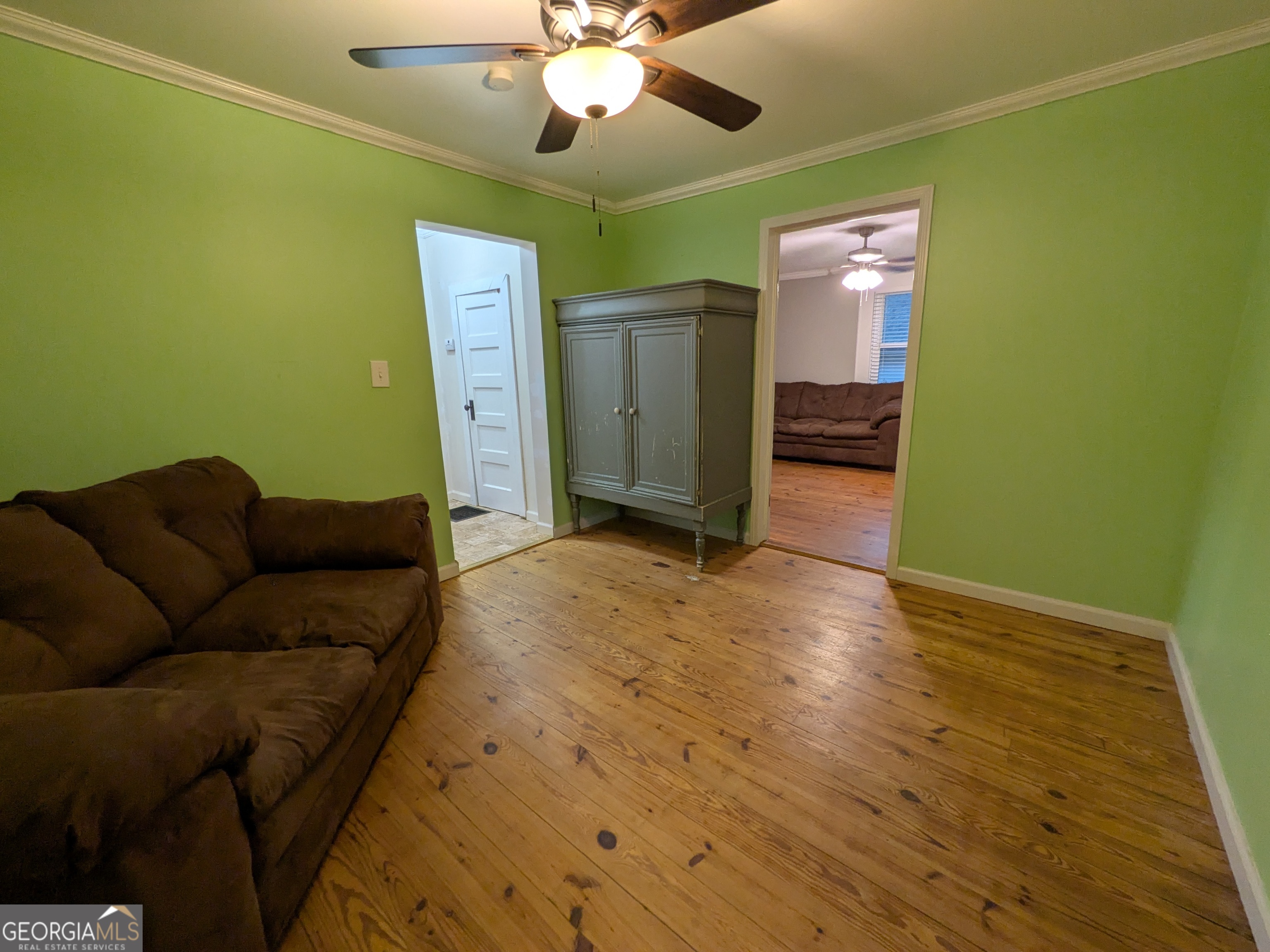 173 Baugh Street Commerce, GA 30529 - Photo 18 of 24 a living room with furniture and a wooden floor