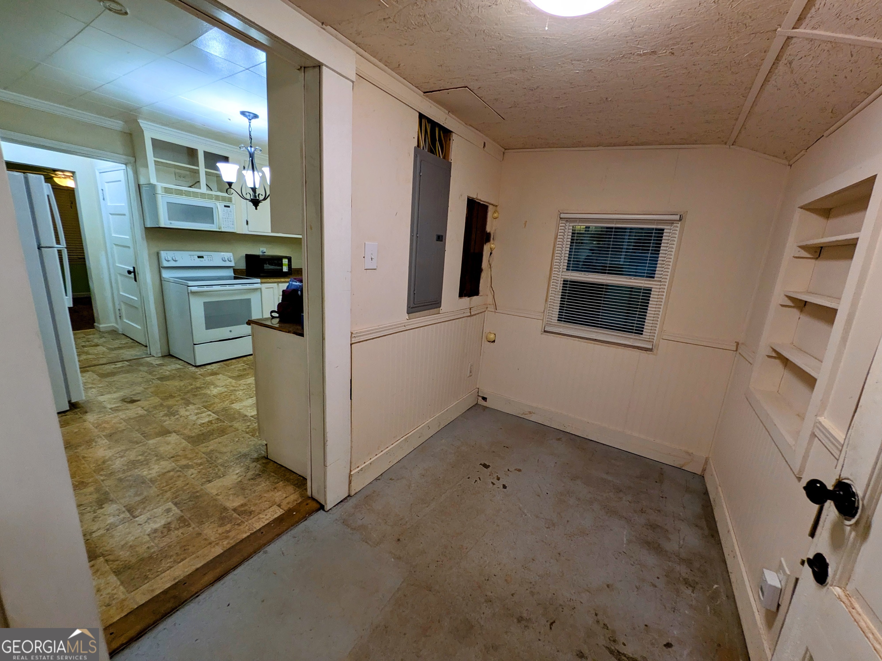 173 Baugh Street Commerce, GA 30529 - Photo 22 of 24 a view of a kitchen with refrigerator and windows