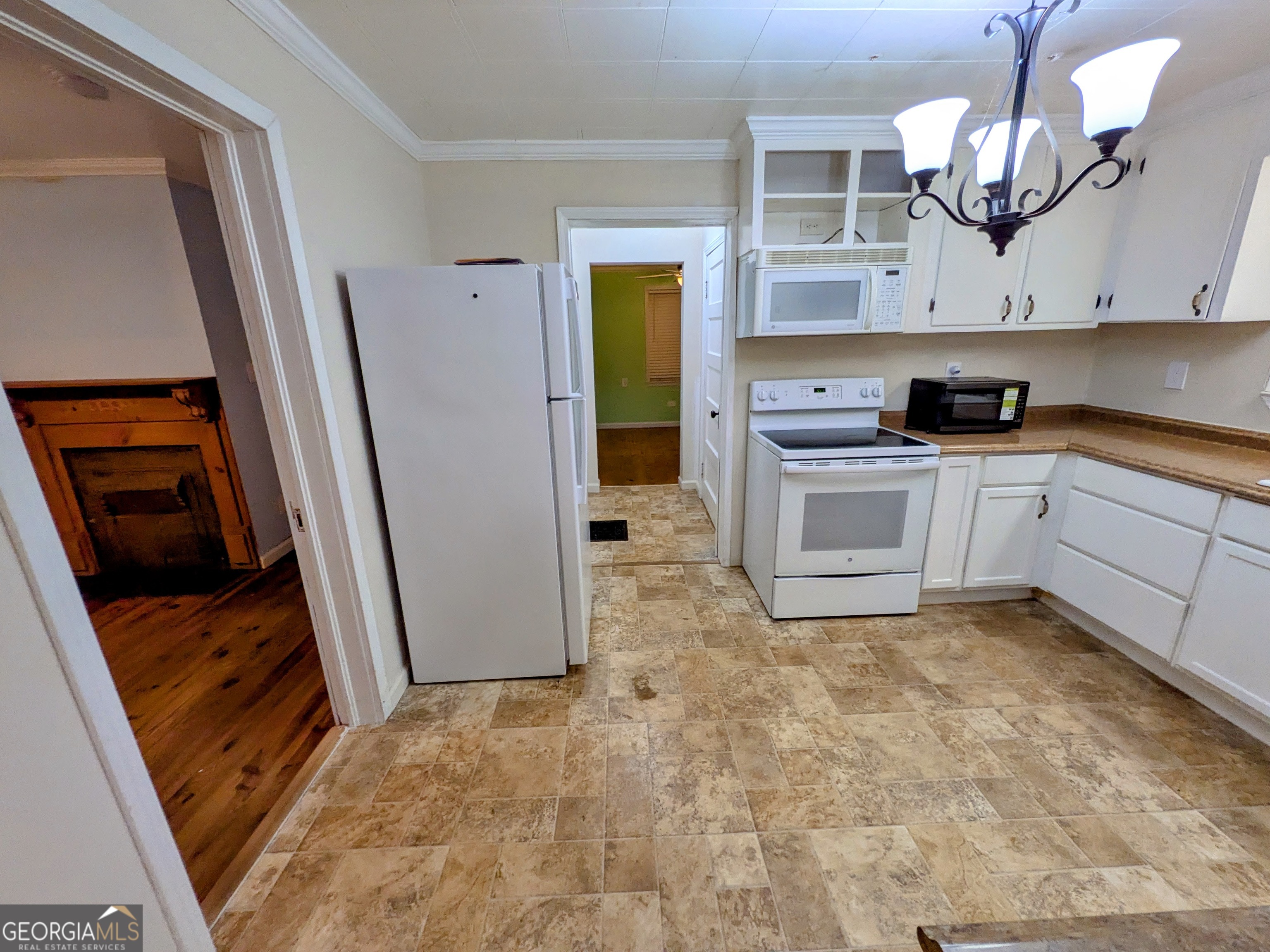 173 Baugh Street Commerce, GA 30529 - Photo 24 of 24 a kitchen with stainless steel appliances granite countertop a stove a sink and a refrigerator