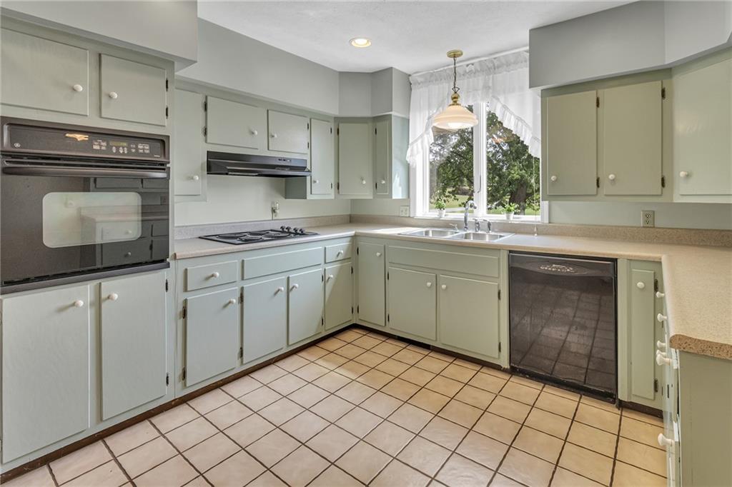 1897 Houston Road Enon Valley, PA 16120 - Photo 9 of 29 Kitchen Has Lots of Cabinets and a Walk in Pantry Area