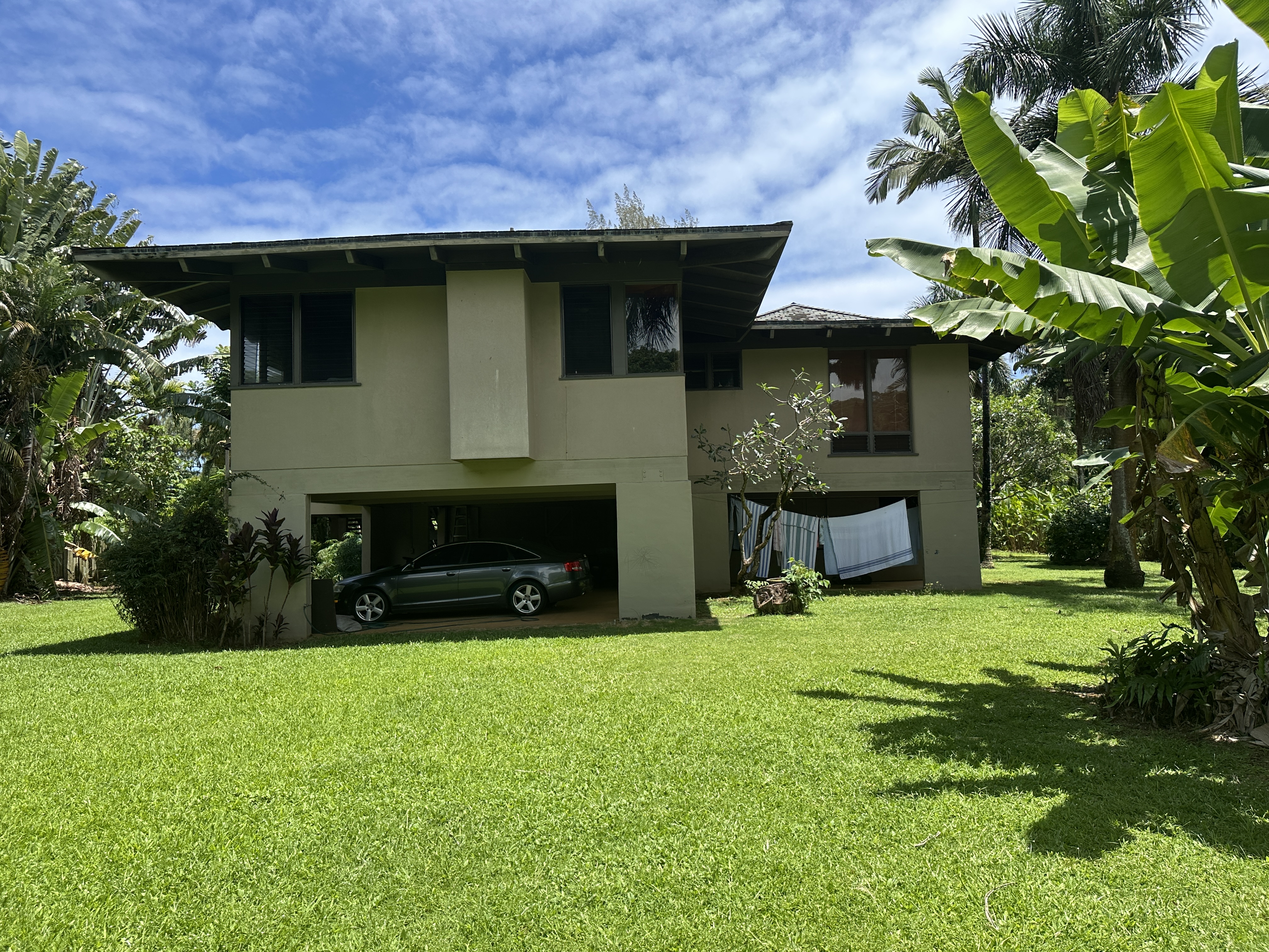 3557 Anini Road Princeville, HI 96722 - Photo 15 of 29 a front view of a house with yard