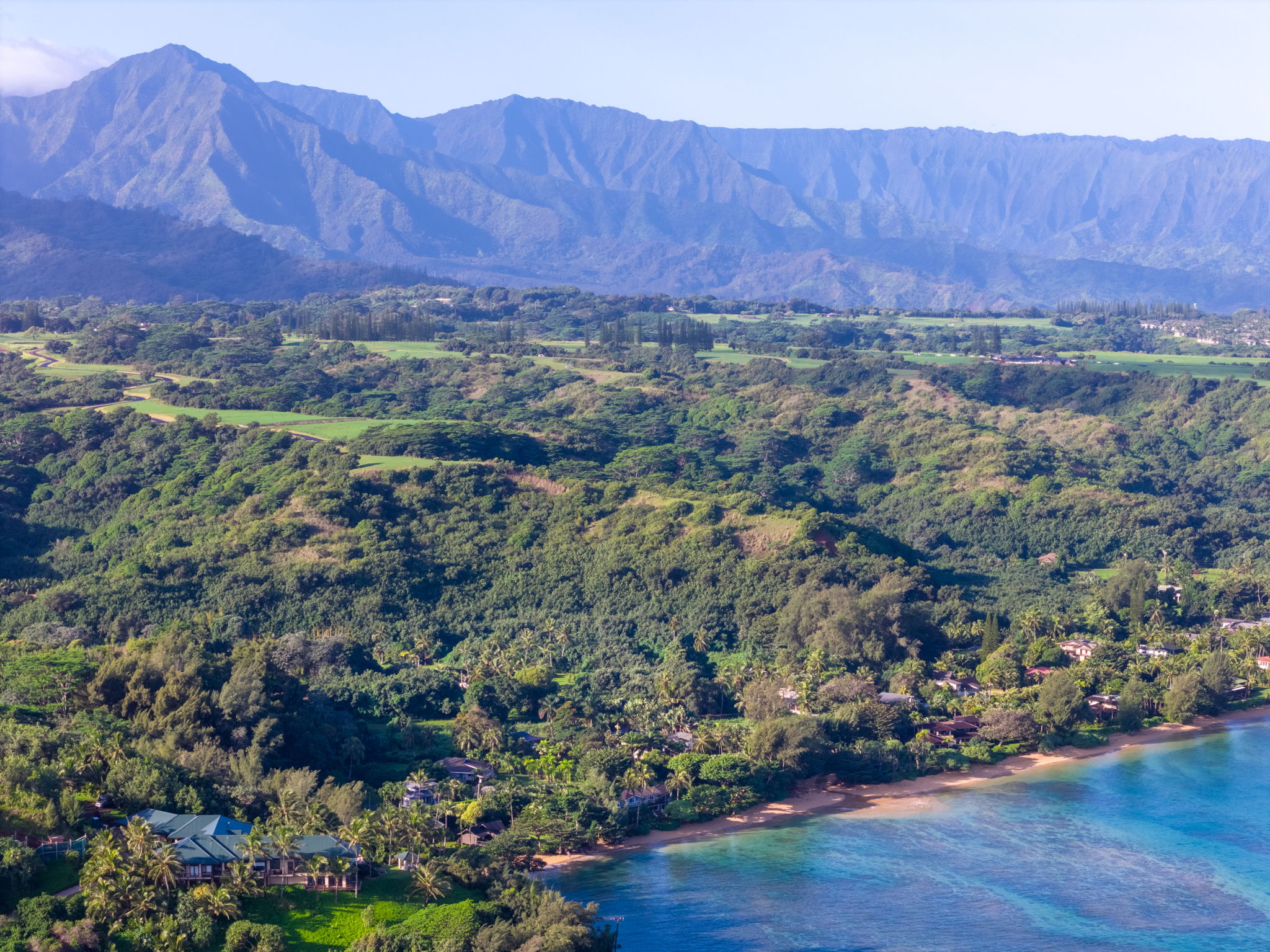 3557 Anini Road Princeville, HI 96722 - Photo 27 of 29 a view of a lush green field with mountains in the background