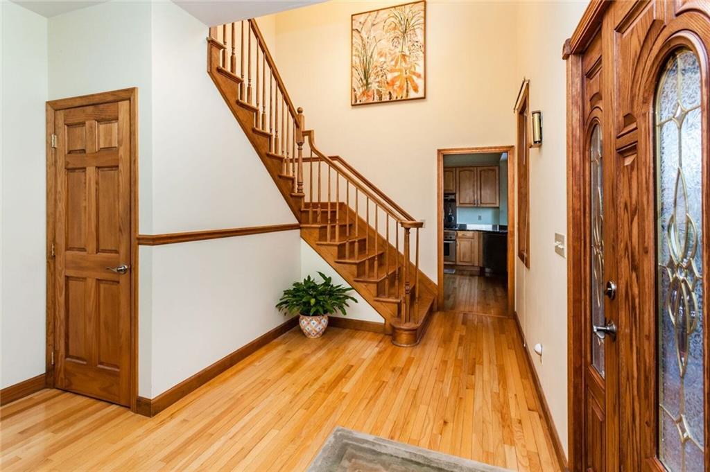 2572 Wexford Run Road Wexford, PA 15090 - Photo 2 of 25 Step into the bright foyer that is partially 2 story at the staircase. The beautiful hardwood floor extends throughout the entire 1st floor except for the master bath & 1/2 bath which are marble tile.