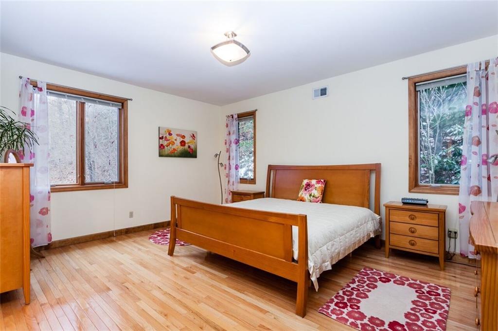 2572 Wexford Run Road Wexford, PA 15090 - Photo 13 of 25 The spacious 1st floor master bedroom easily accommodates a king size bed as well as dressers and bedside tables without feeling cramped.
