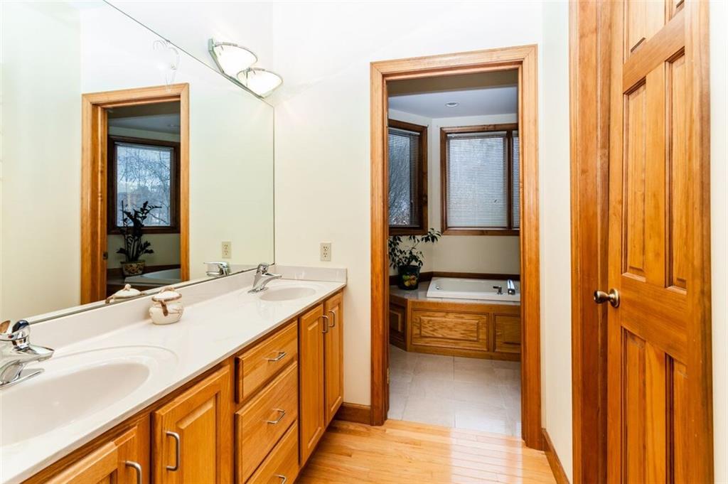 2572 Wexford Run Road Wexford, PA 15090 - Photo 15 of 25 There is plenty of storage space under the master bath sinks! The door to the right leads to the spacious walk in closet.