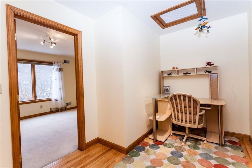 2572 Wexford Run Road Wexford, PA 15090 - Photo 20 of 25 The second floor landing area creates a cozy place for a computer or reading nook! The hardwood floor from the first floor extends up the stairs and onto the landing.