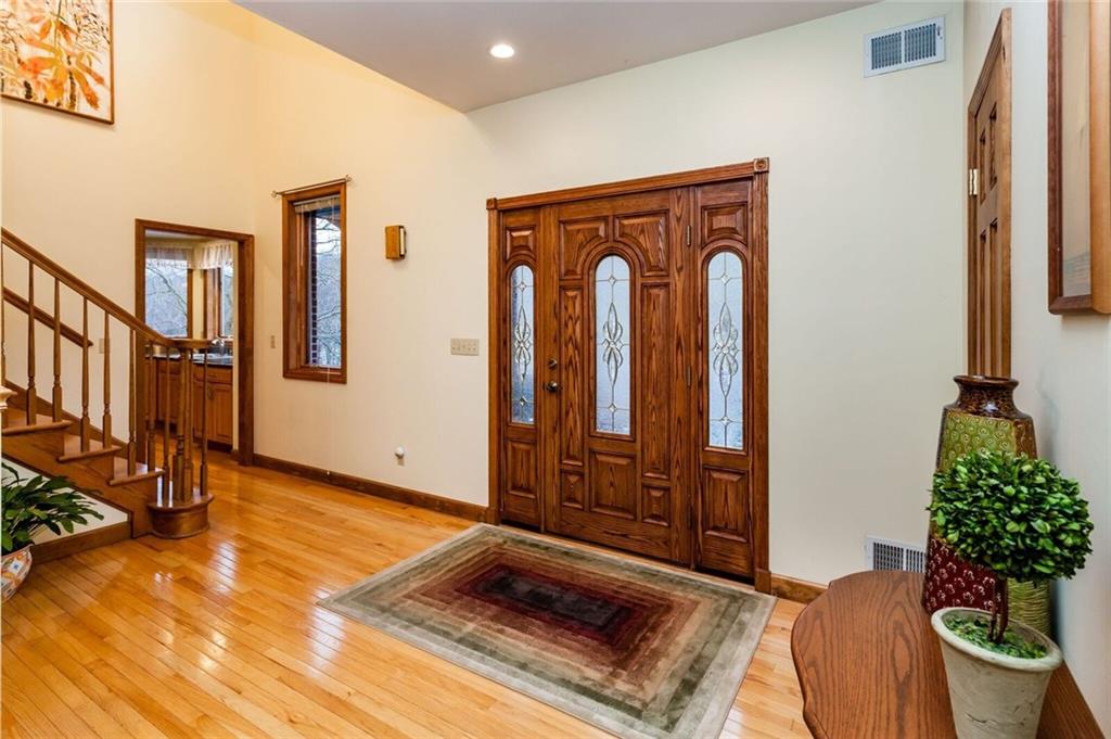 2572 Wexford Run Road Wexford, PA 15090 - Photo 3 of 25 The beautiful front door that leads to a covered front porch! The 1/2 bath is just off the foyer.