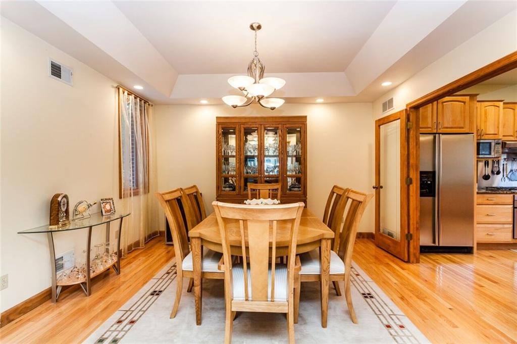 2572 Wexford Run Road Wexford, PA 15090 - Photo 6 of 25 The dining room features a tray ceiling accented with recessed lighting. A set of wood and glass French style doors leads to the kitchen.