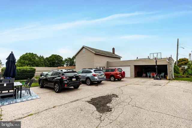 a view of a cars park in front of house