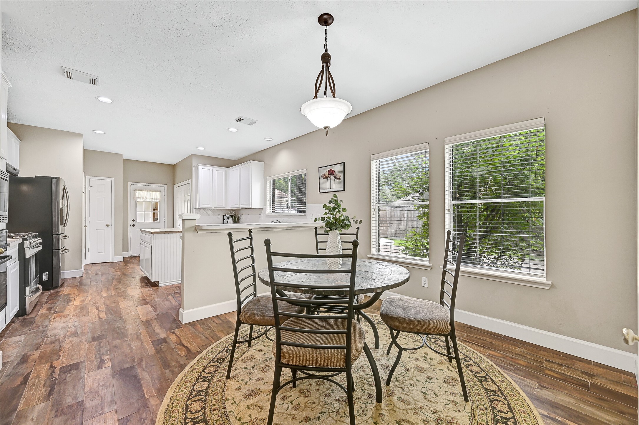 1606 Falcon Ridge Boulevard Friendswood, TX 77546 - Photo 11 of 24 a dining room with furniture and window