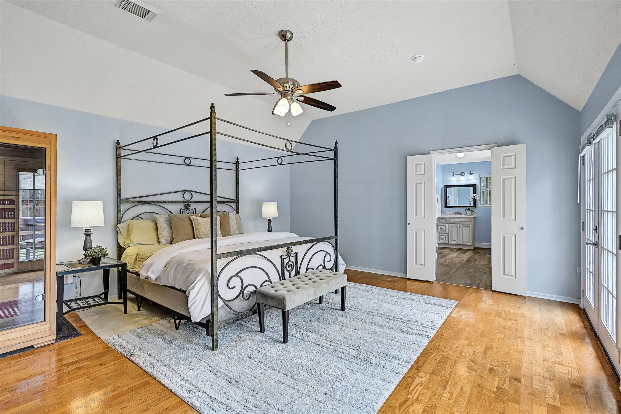 1606 Falcon Ridge Boulevard Friendswood, TX 77546 - Photo 15 of 24 a bedroom with a bed and wooden floor