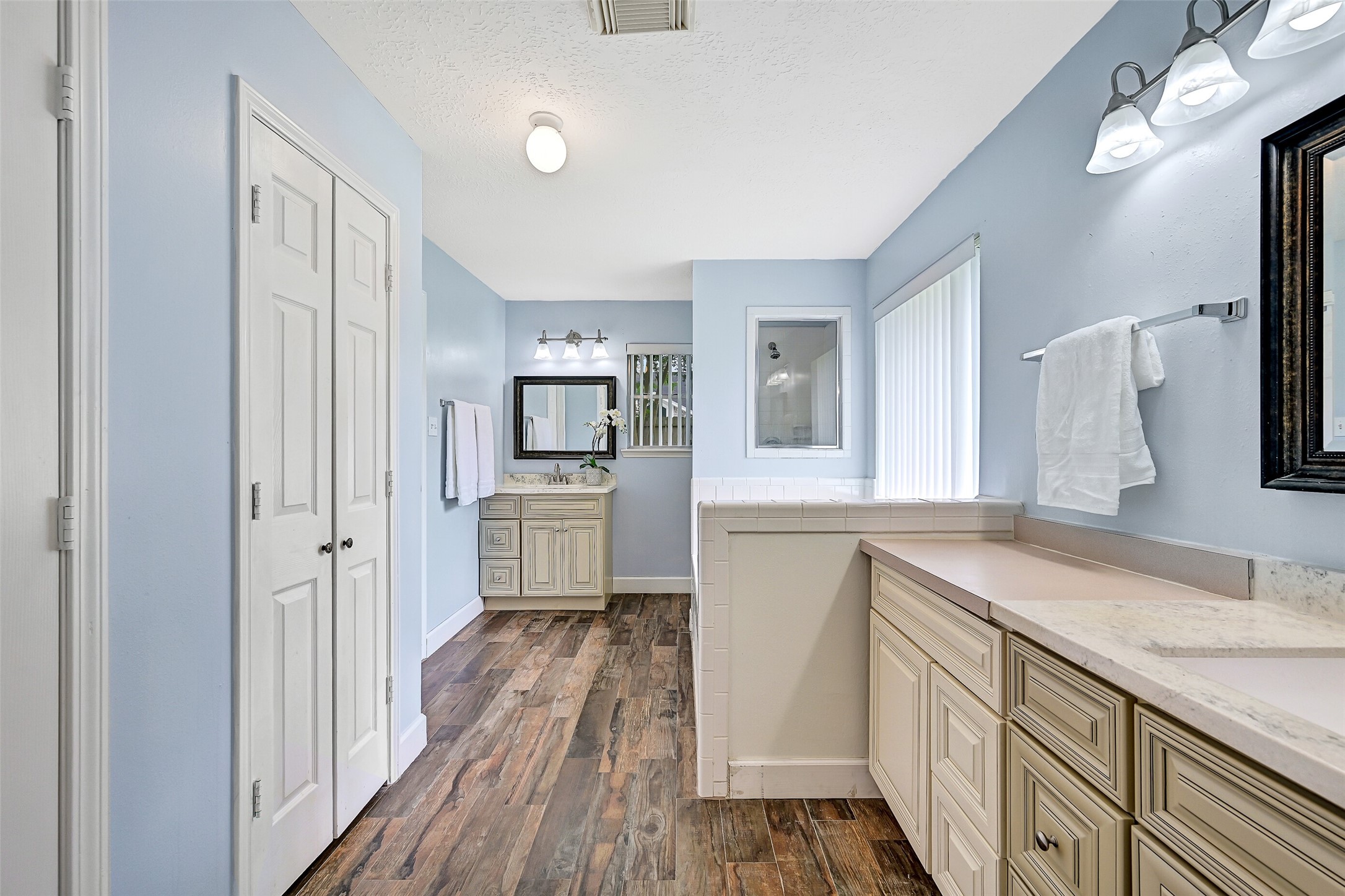 1606 Falcon Ridge Boulevard Friendswood, TX 77546 - Photo 17 of 24 a view of a kitchen with a sink and dishwasher with wooden floor
