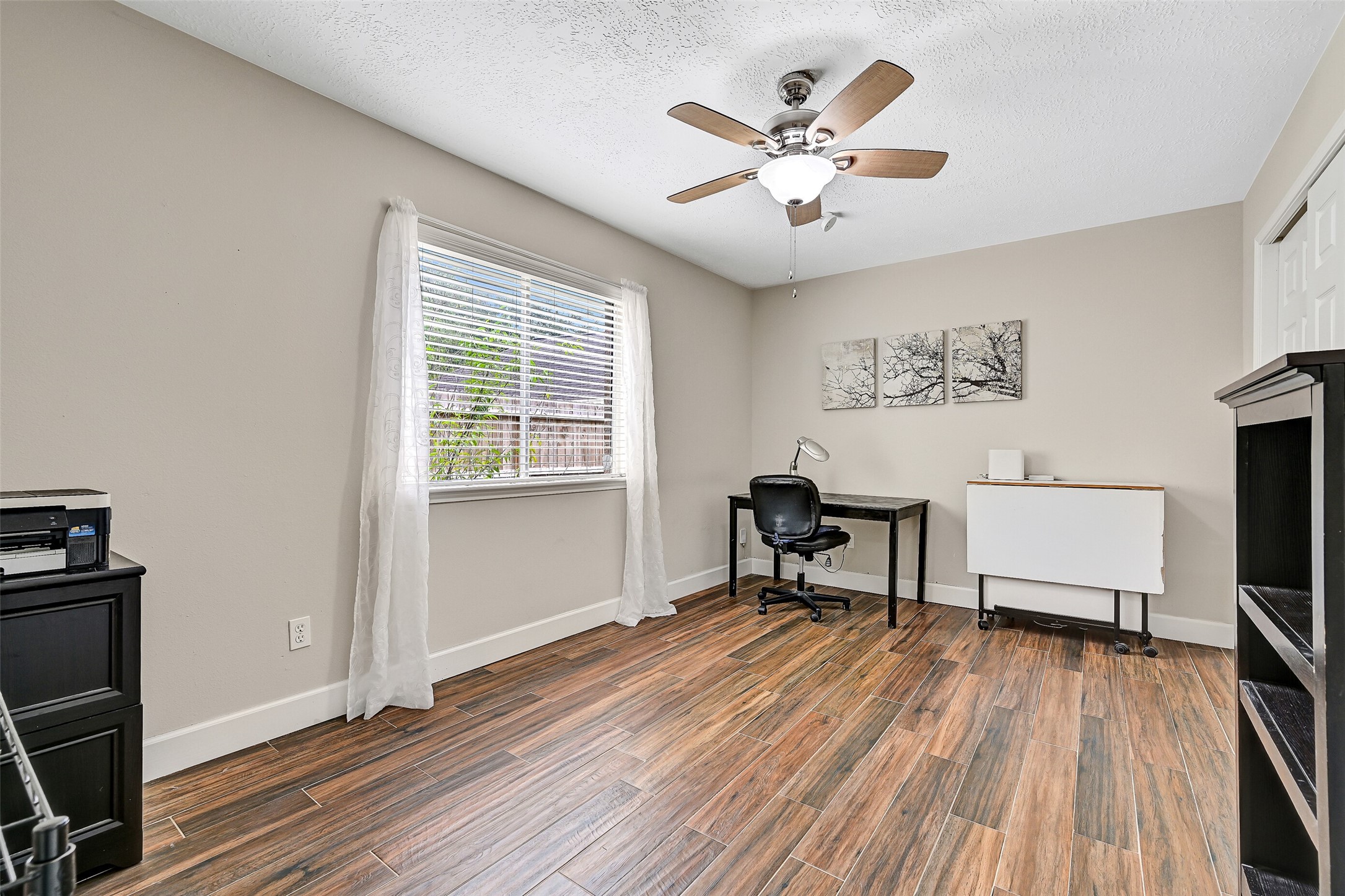 1606 Falcon Ridge Boulevard Friendswood, TX 77546 - Photo 23 of 24 a work room with wooden floor and windows