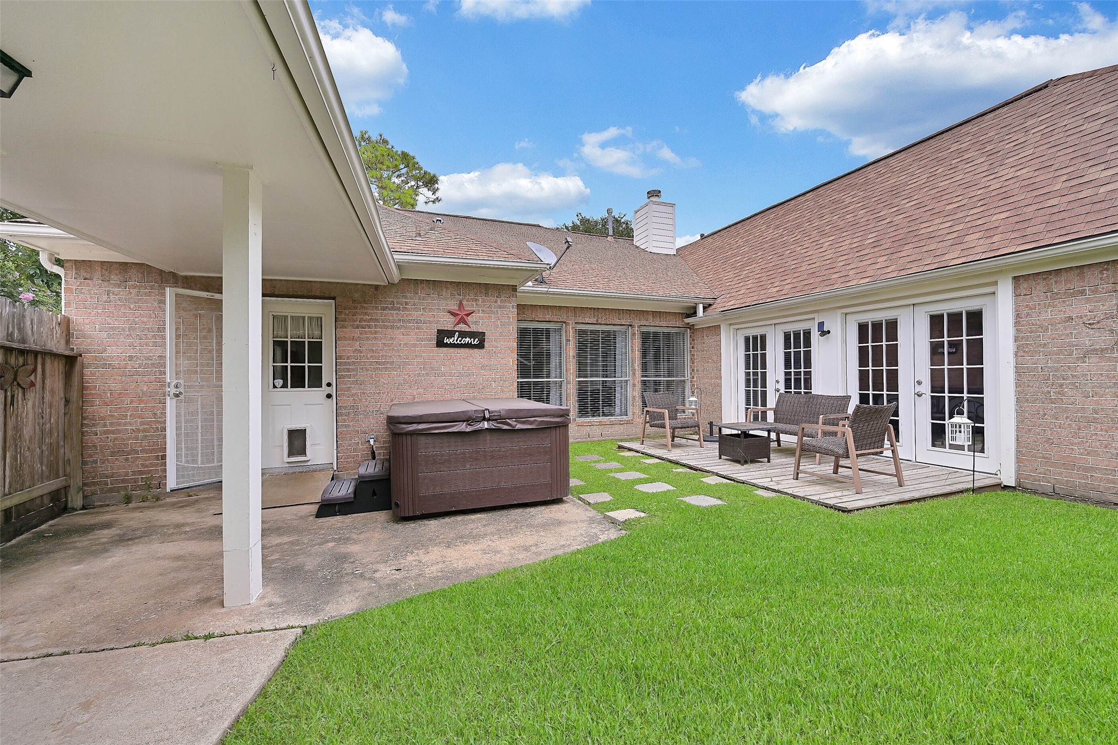 1606 Falcon Ridge Boulevard Friendswood, TX 77546 - Photo 21 of 24 a front view of house with yard and outdoor seating