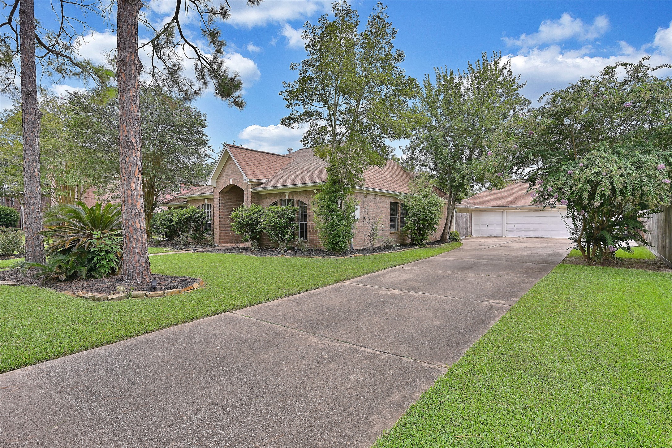 1606 Falcon Ridge Boulevard Friendswood, TX 77546 - Photo 3 of 24 a view of a house with a yard