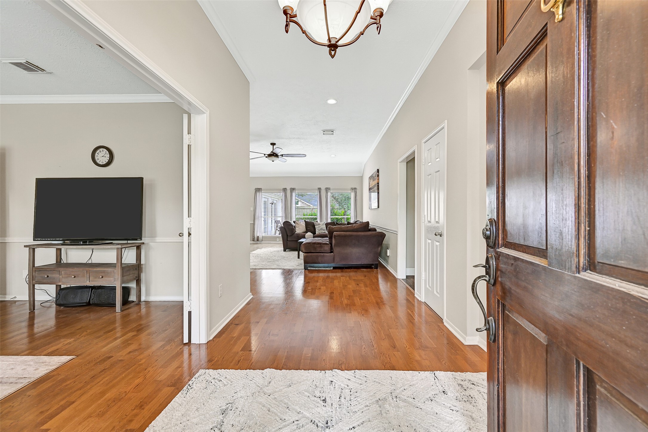 1606 Falcon Ridge Boulevard Friendswood, TX 77546 - Photo 4 of 24 a living room with furniture flat screen tv and wooden floor