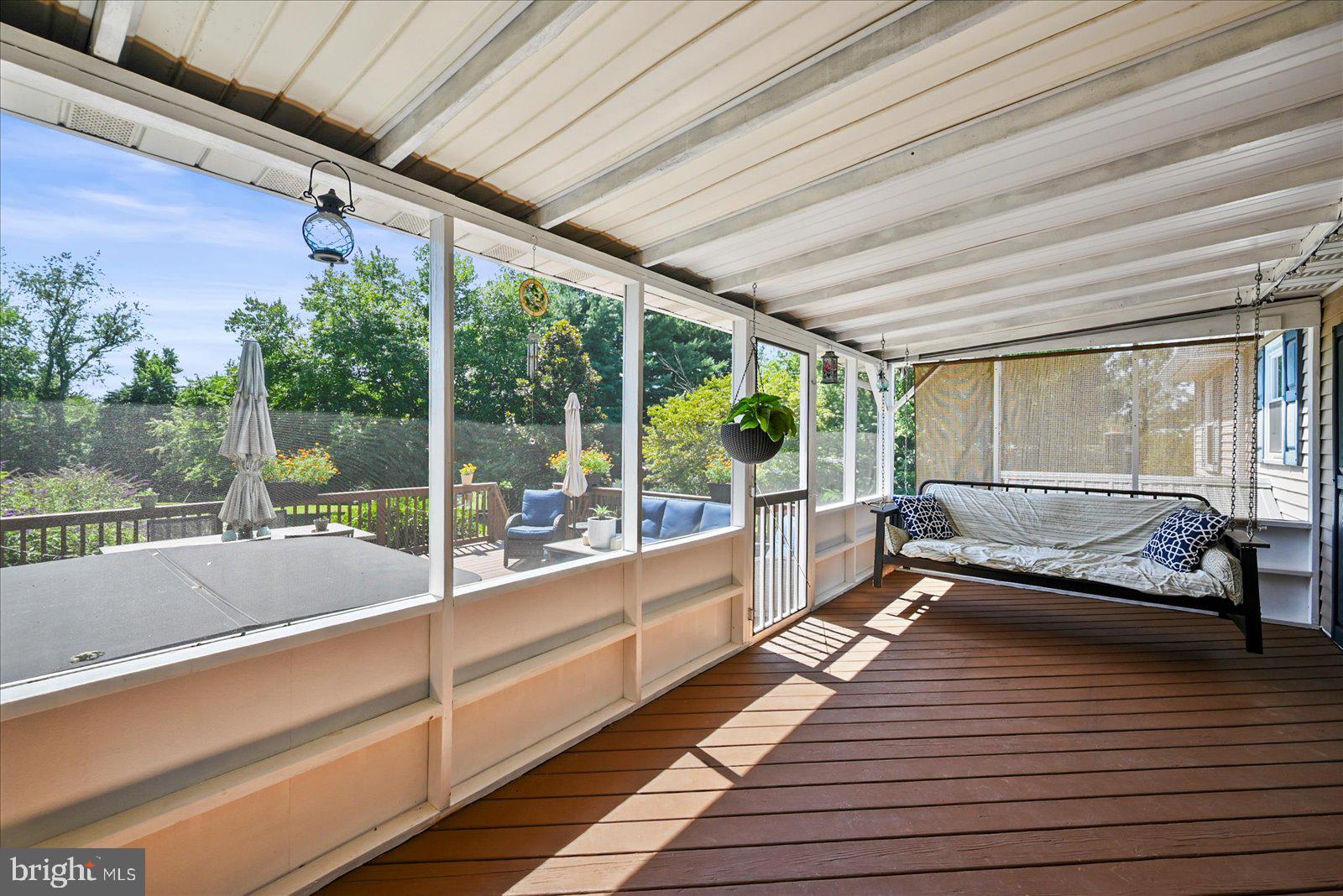 253 Kindig Road Littlestown, PA 17340 - Photo 25 of 41 Serene screened porch with lush views.