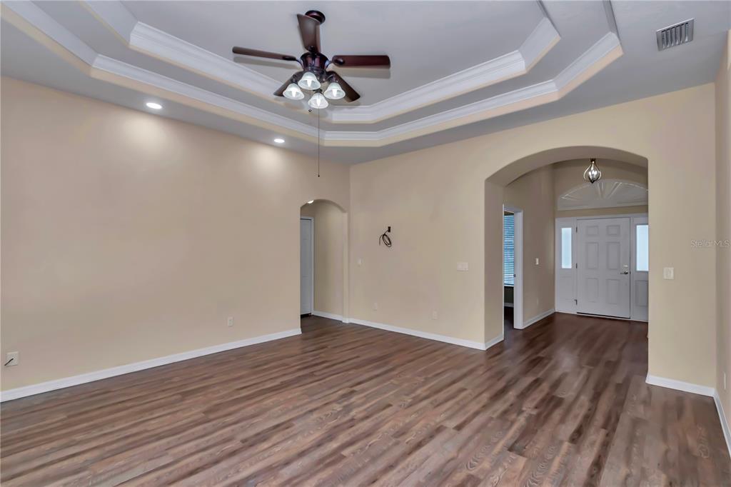 57 Chrysanthemum Drive Ormond Beach, FL 32174 - Photo 11 of 35 a view of an empty room and wooden floor