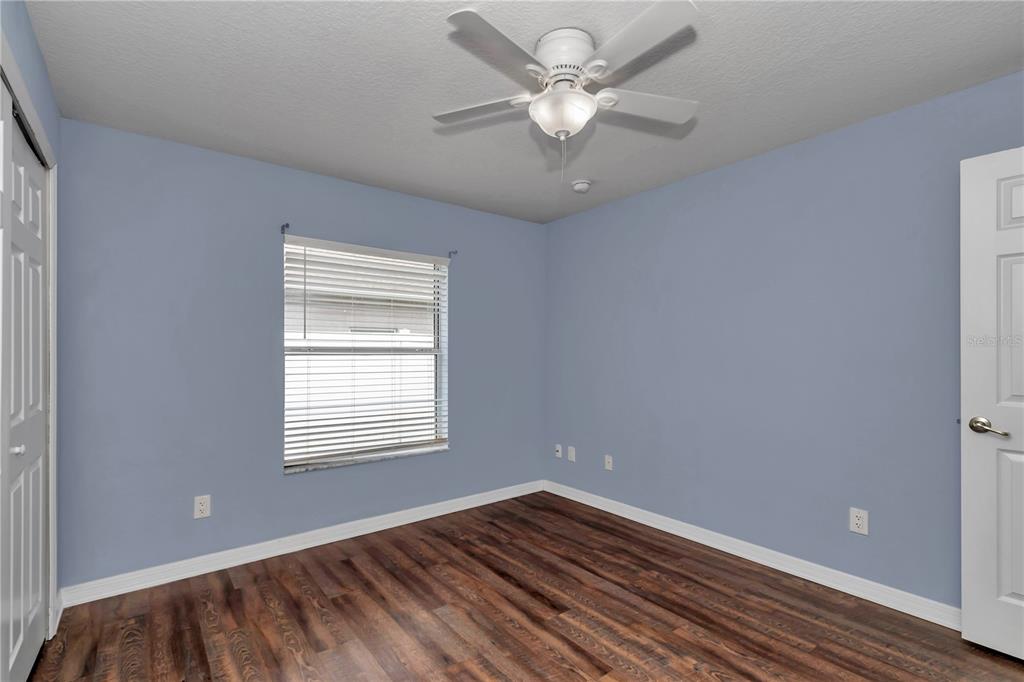 57 Chrysanthemum Drive Ormond Beach, FL 32174 - Photo 21 of 35 wooden floor in an empty room with a window