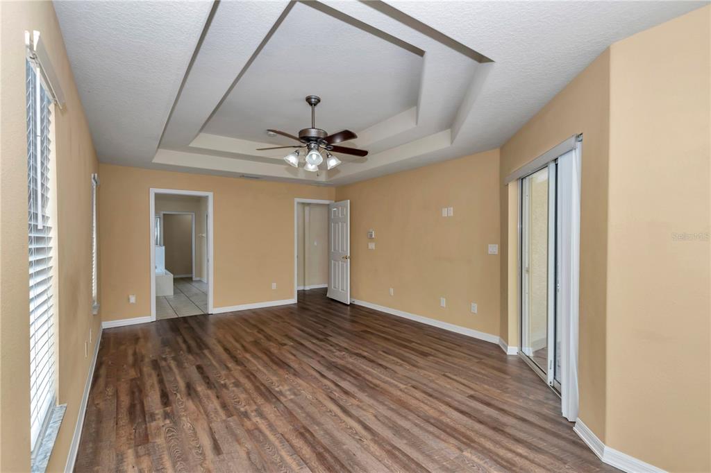 57 Chrysanthemum Drive Ormond Beach, FL 32174 - Photo 26 of 35 a view of an empty room and wooden floor