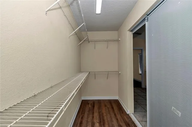 a spacious bathroom with a double vanity sink and a mirror