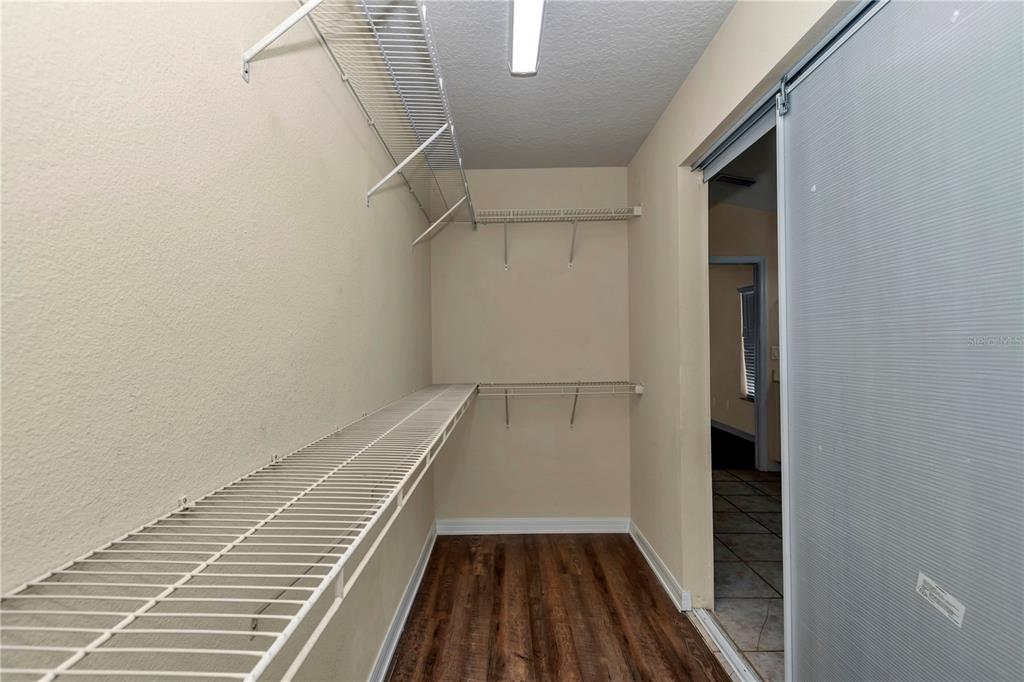57 Chrysanthemum Drive Ormond Beach, FL 32174 - Photo 28 of 35 a view of a hallway with wooden floor and entryway