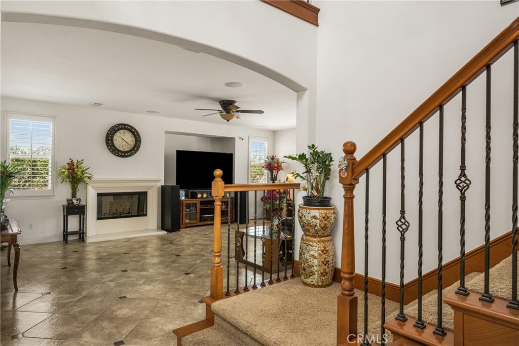 12652 Twin Peak Court Riverside, CA 92503 - Photo 7 of 55 a view of a livingroom with furniture staircase and fireplace