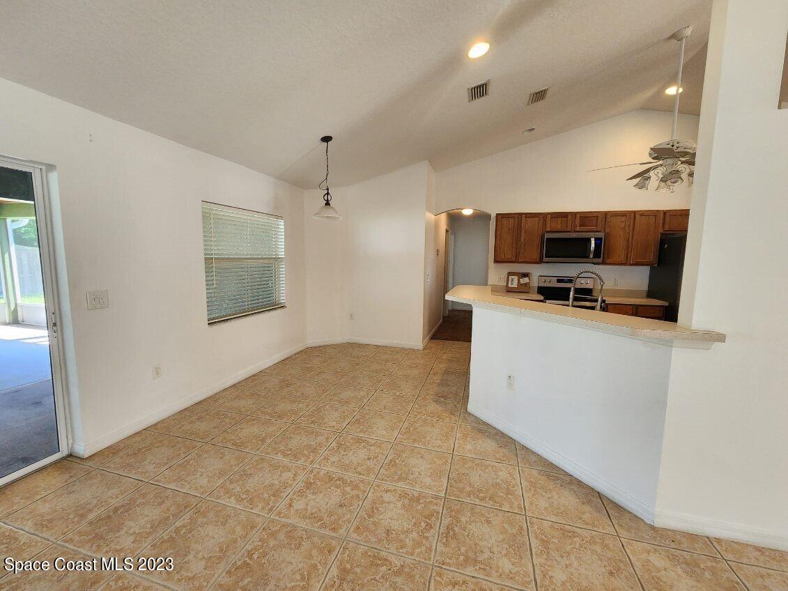 2004 Gloria Circle Palm Bay, FL 32905 - Photo 12 of 54 a view of kitchen and microwave