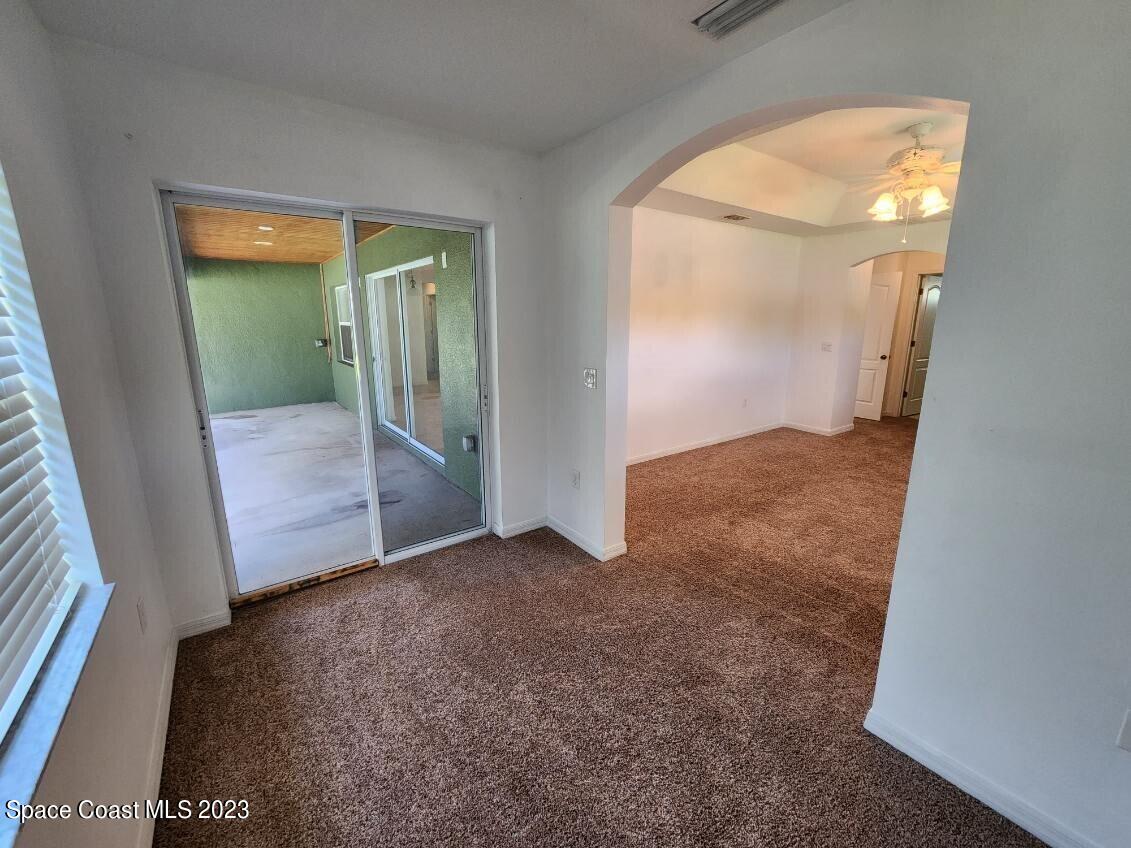 2004 Gloria Circle Palm Bay, FL 32905 - Photo 27 of 54 an empty room with sliding door and mirror