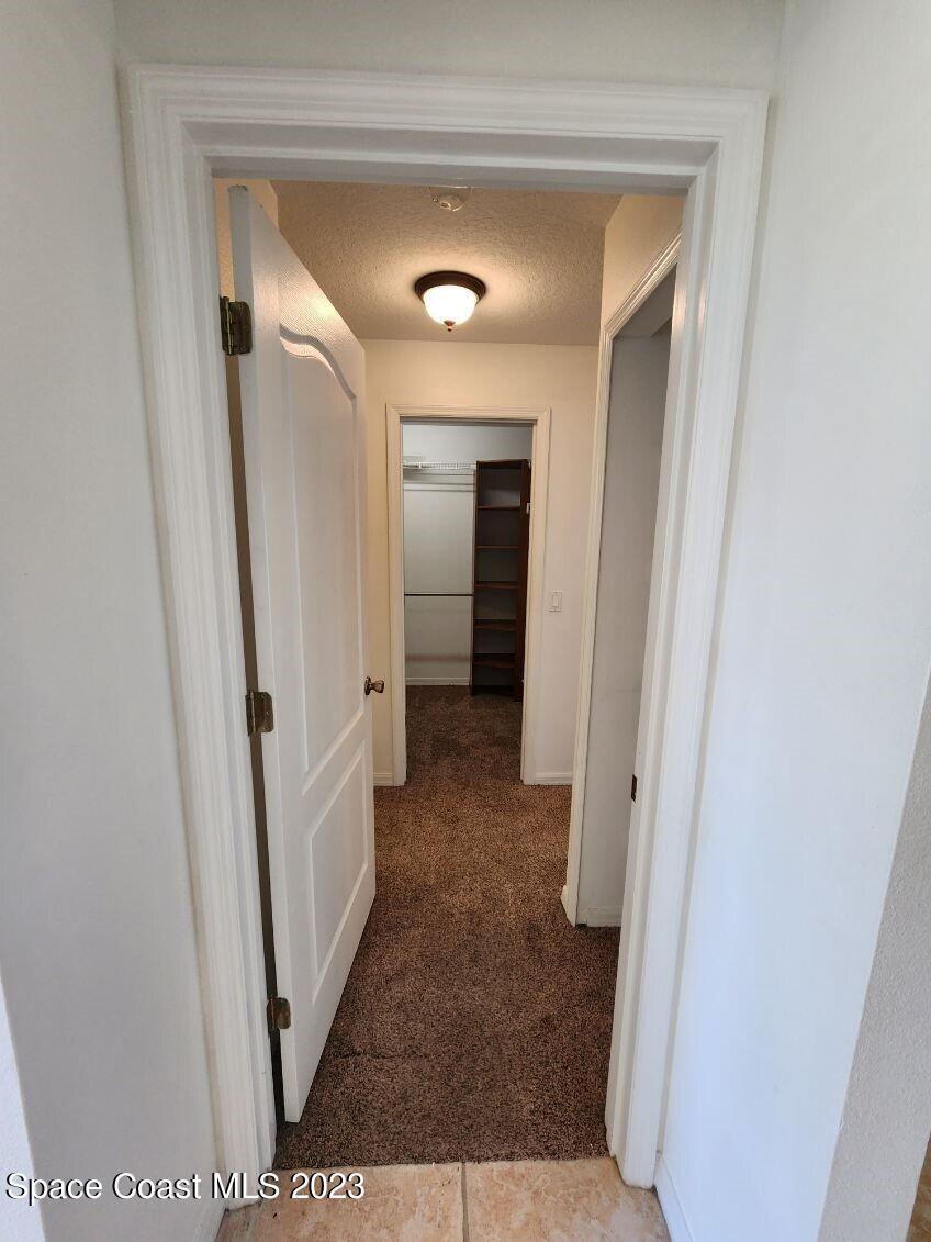 2004 Gloria Circle Palm Bay, FL 32905 - Photo 29 of 54 a view of a hallway view with wooden floor and closet