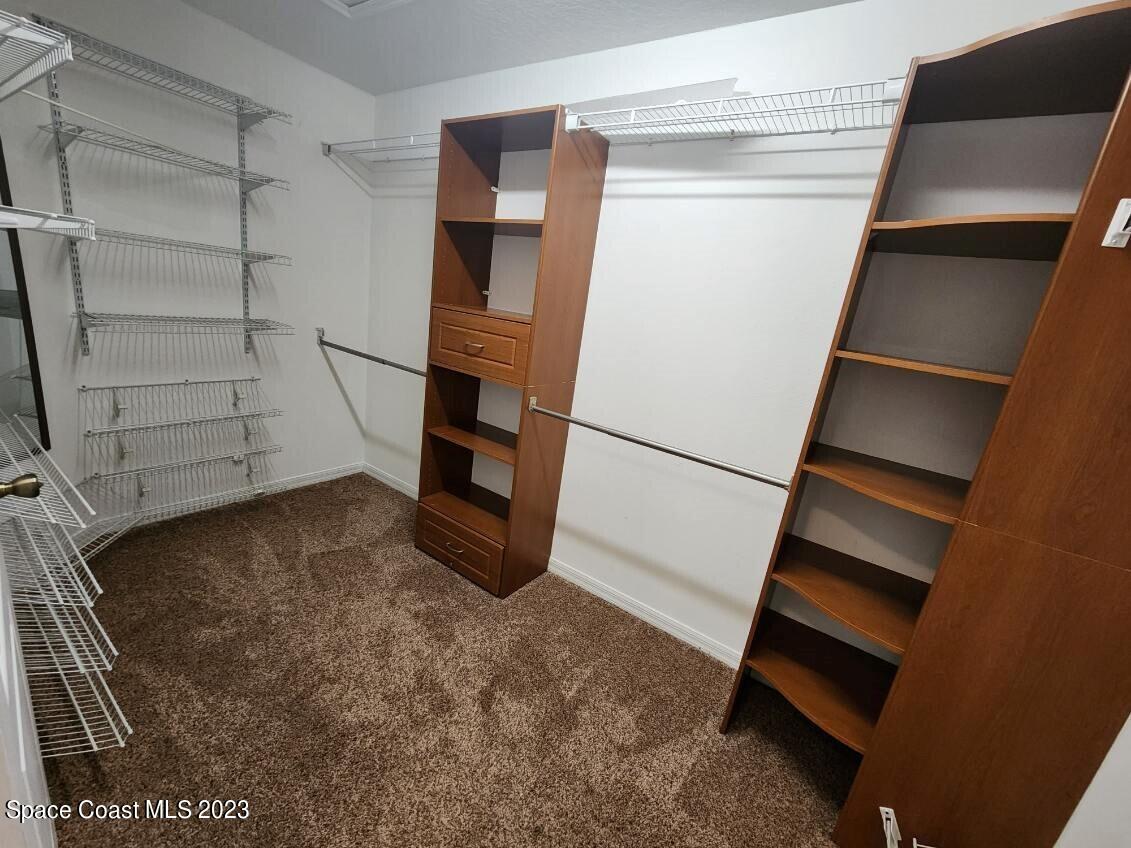 2004 Gloria Circle Palm Bay, FL 32905 - Photo 32 of 54 a view of walk in closet with empty racks