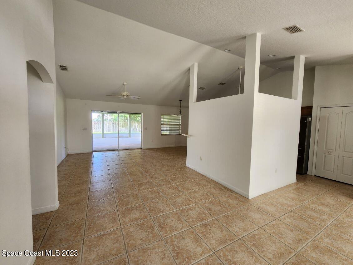 2004 Gloria Circle Palm Bay, FL 32905 - Photo 43 of 54 a view of a hallway with kitchen and entryway