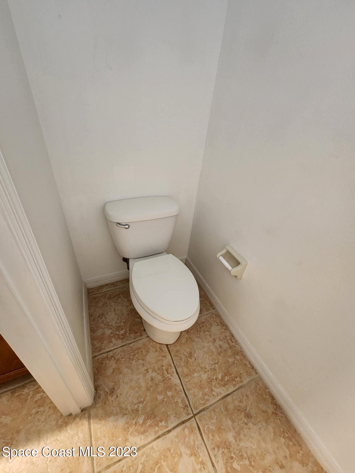 2004 Gloria Circle Palm Bay, FL 32905 - Photo 44 of 54 a white toilet sitting next to a white wall