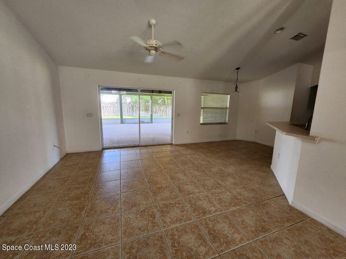 2004 Gloria Circle Palm Bay, FL 32905 - Photo 45 of 54 an empty room with windows and fireplace