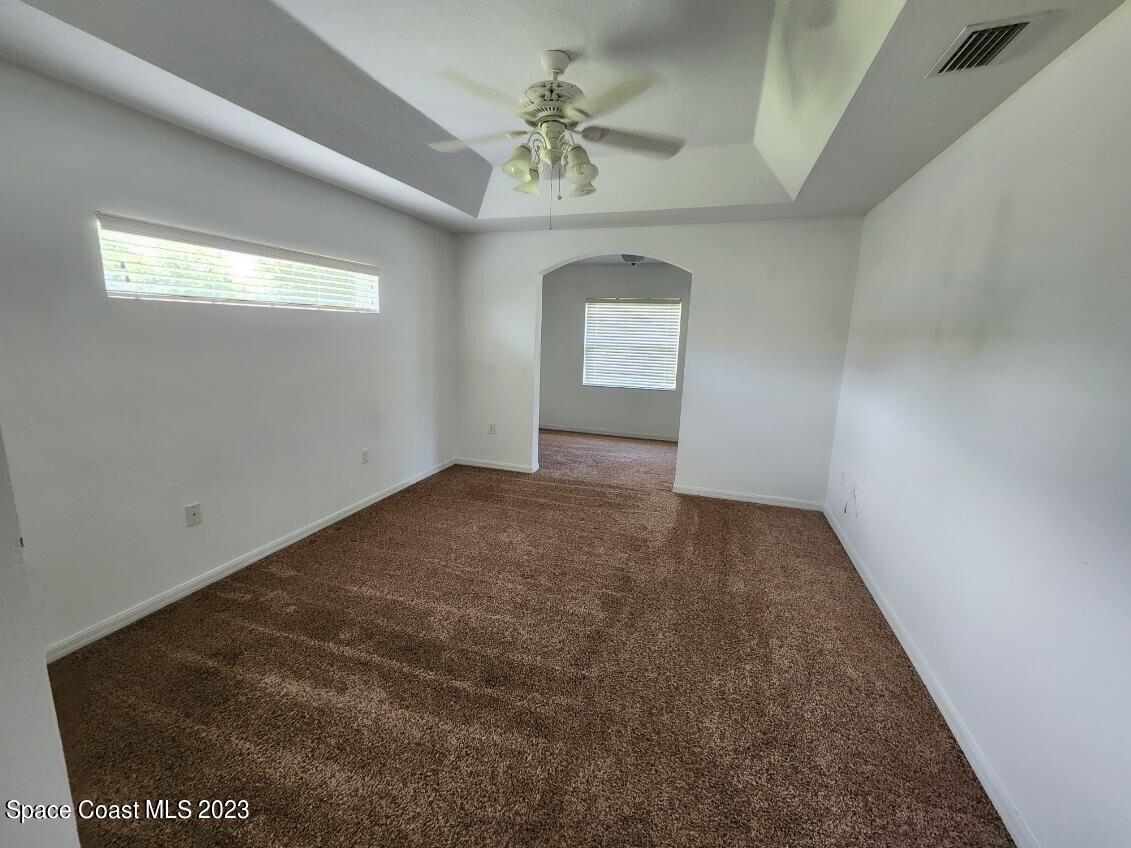 2004 Gloria Circle Palm Bay, FL 32905 - Photo 48 of 54 an empty room with windows and closet