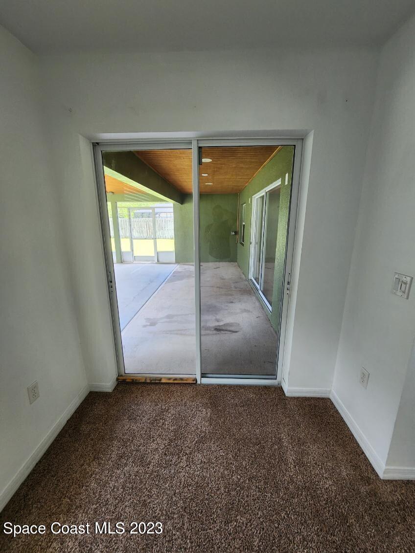 2004 Gloria Circle Palm Bay, FL 32905 - Photo 51 of 54 an empty room with a floor to ceiling window