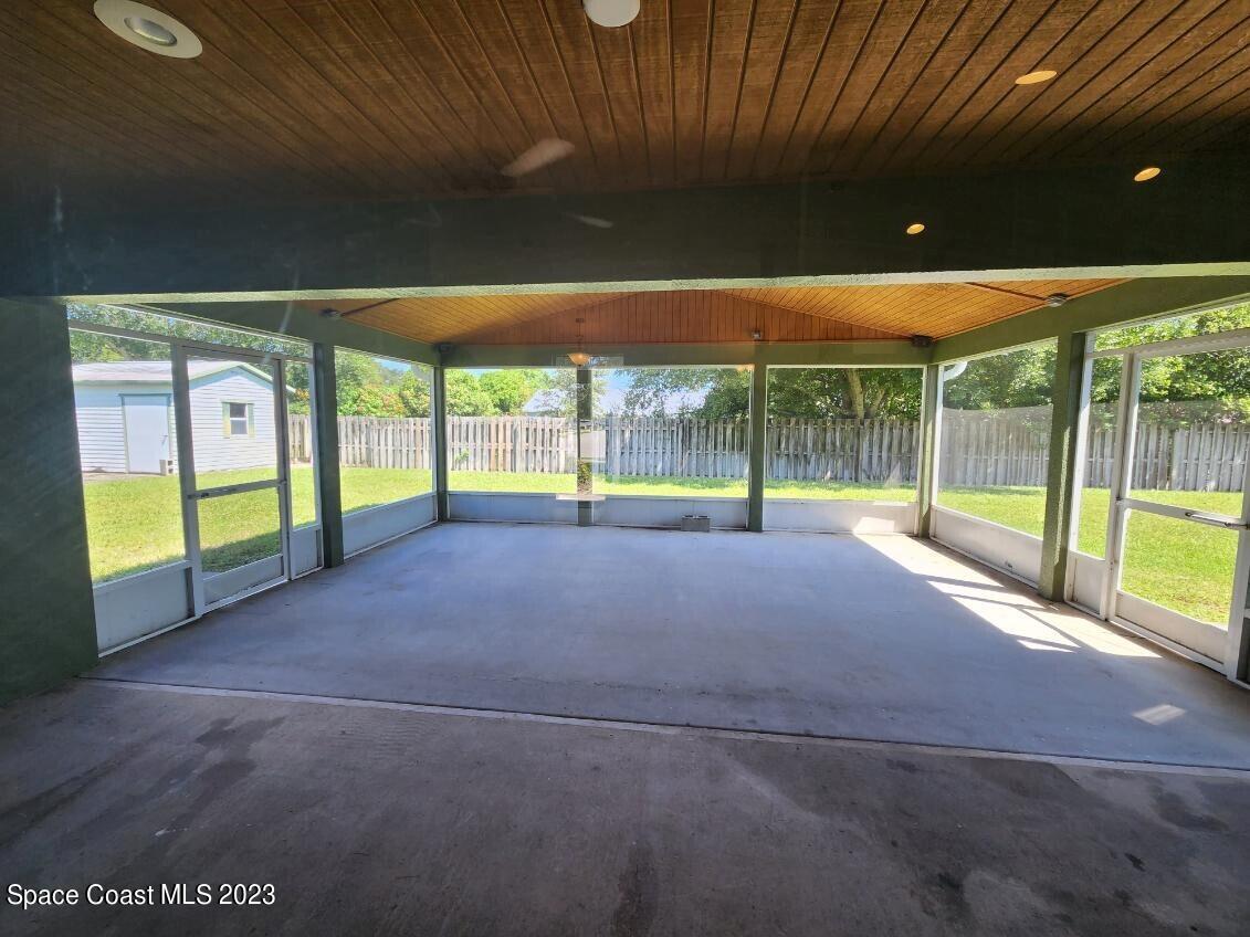 2004 Gloria Circle Palm Bay, FL 32905 - Photo 53 of 54 a view of an empty room with a sliding door