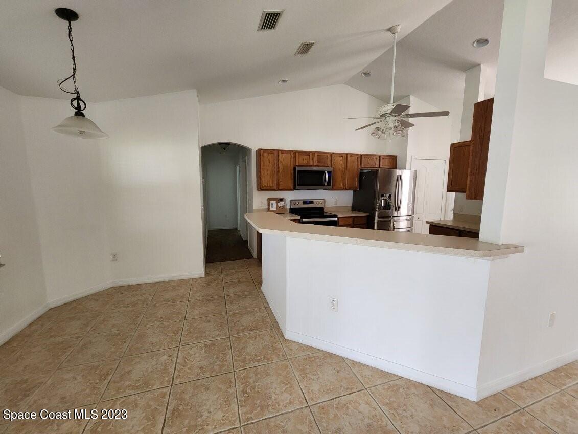 2004 Gloria Circle Palm Bay, FL 32905 - Photo 8 of 54 a view of kitchen and microwave