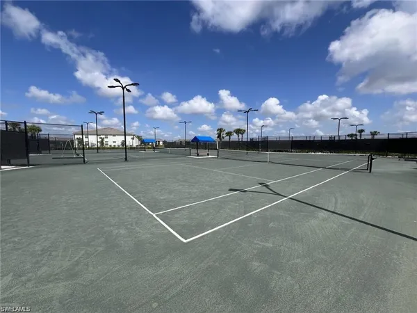 a view of outdoor space and tennis court