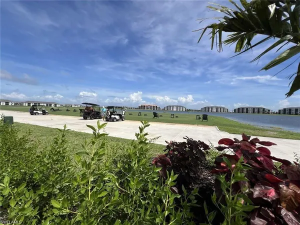 a view of a lake with houses in the background