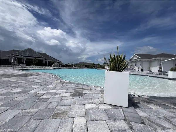 a view of a swimming pool with a patio