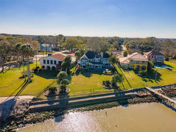 an aerial view of residential houses with outdoor space