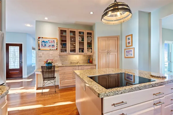 a kitchen that has a sink and a stove