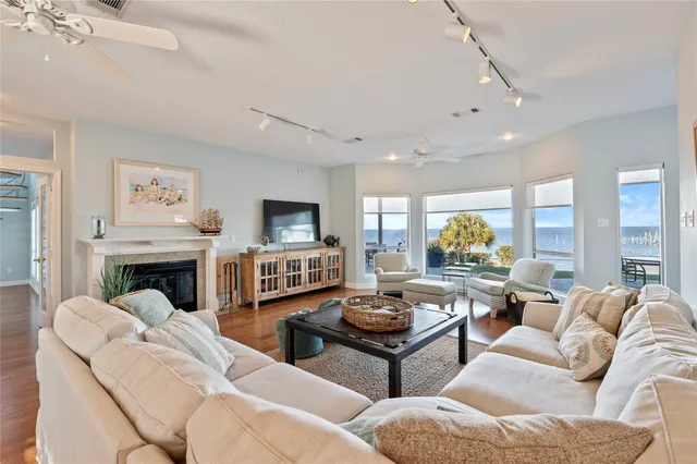 a living room with fireplace furniture and a fireplace