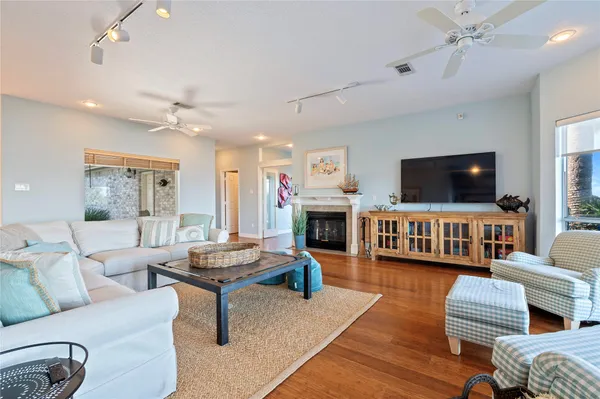 a living room with furniture and a fireplace