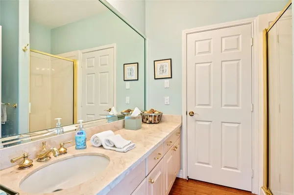 a bathroom with 2 sink and a mirror