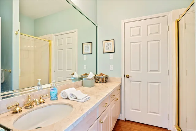 a bathroom with 2 sink and a mirror