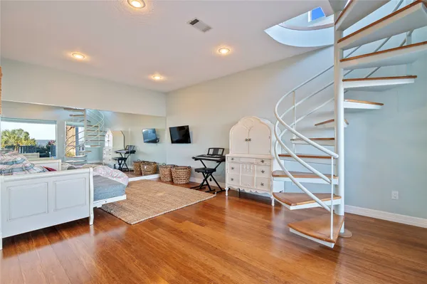 a living room with furniture or wooden floor and a large window
